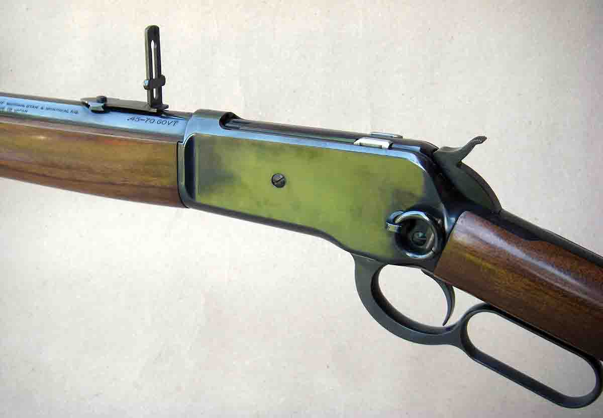 The Browning Model 1886 carbine features a 22-inch barrel, steel buttplate, saddle ring and folding ladder rear sight.